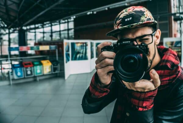 man holding dslr camera